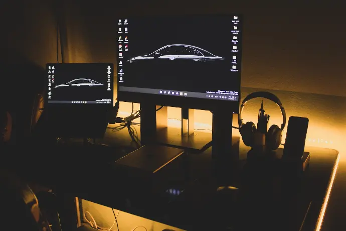 a computer monitor sitting on top of a desk